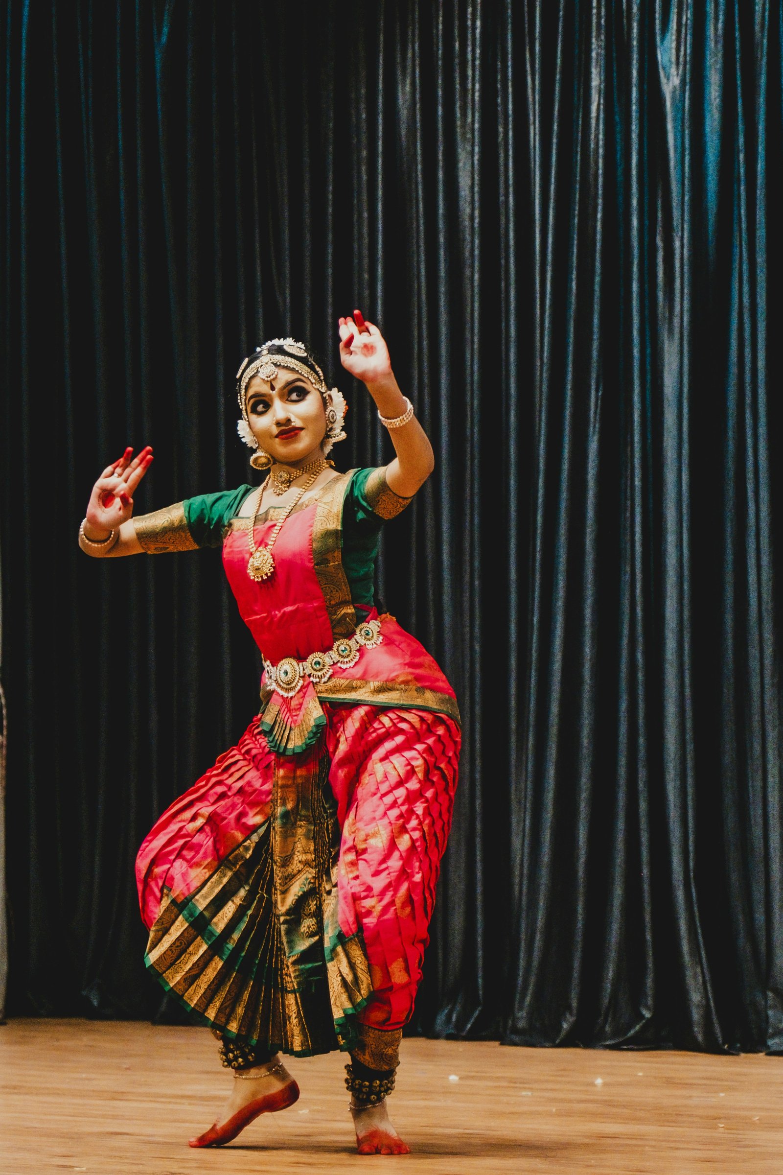 Young Bharatanatyam dancer in a red costume