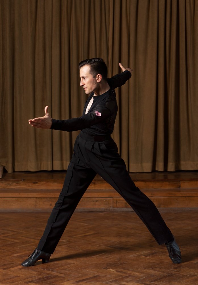 Male dance teacher in a studio pose